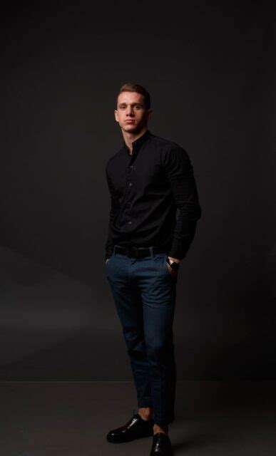 black shirt men's navy pants.